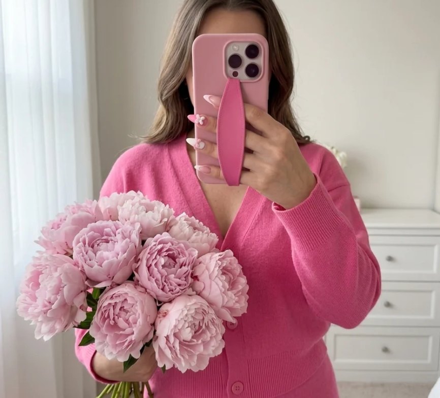 Pink strap on a pink case with peonies